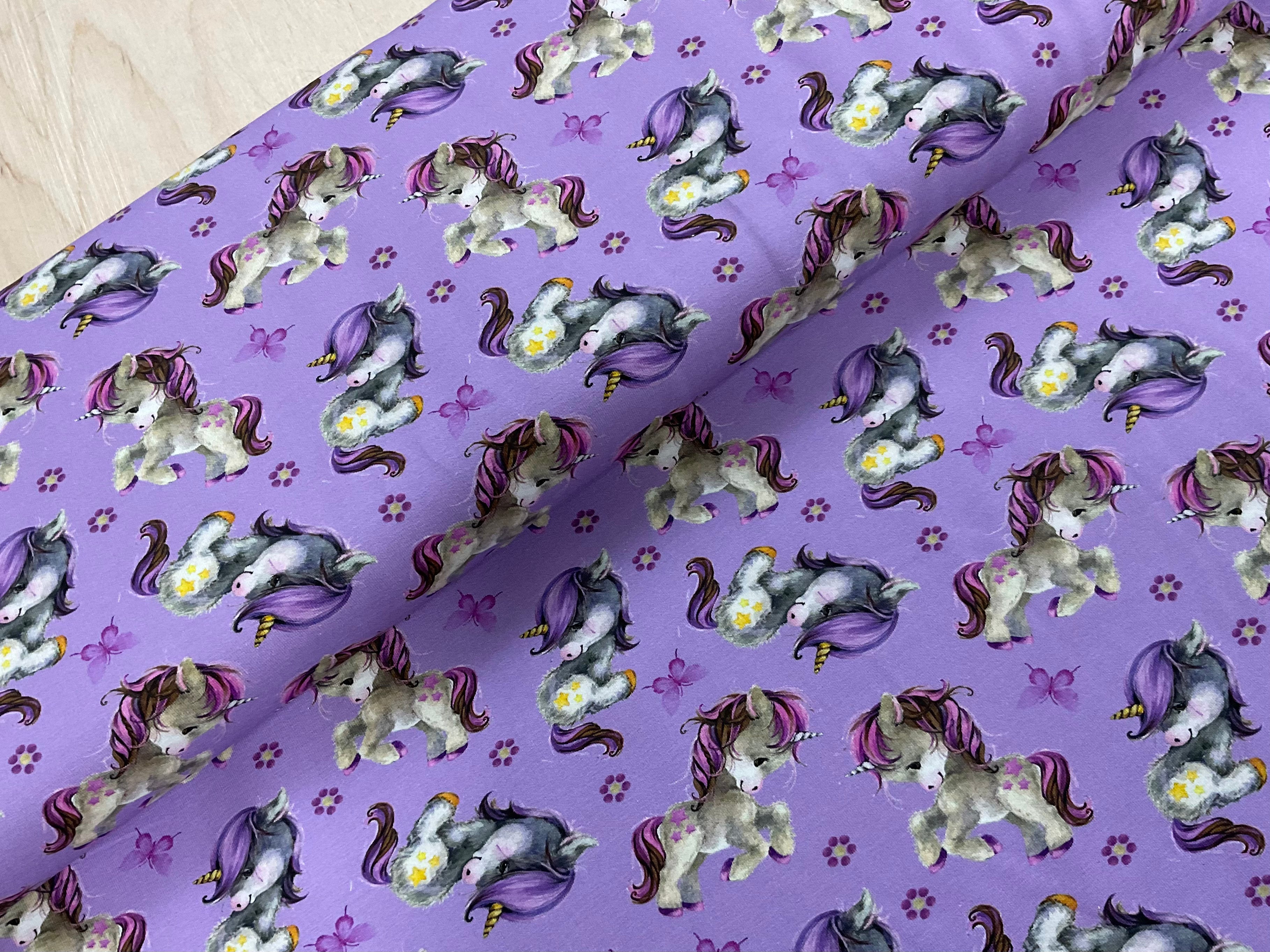 Cute Unicorns on Lilac Cotton Jersey Fabric