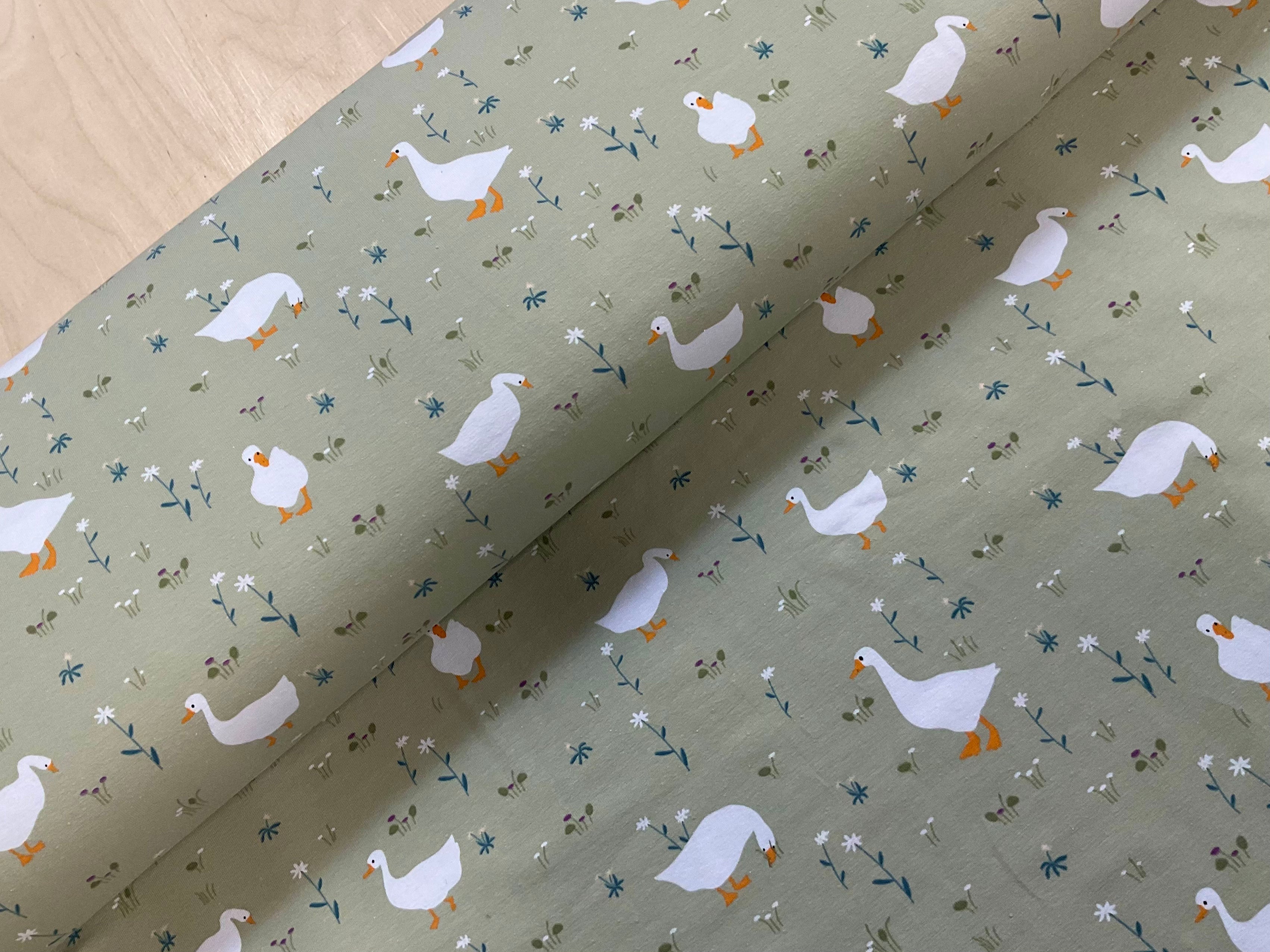 Geese on Pea Green Cotton Jersey Fabric