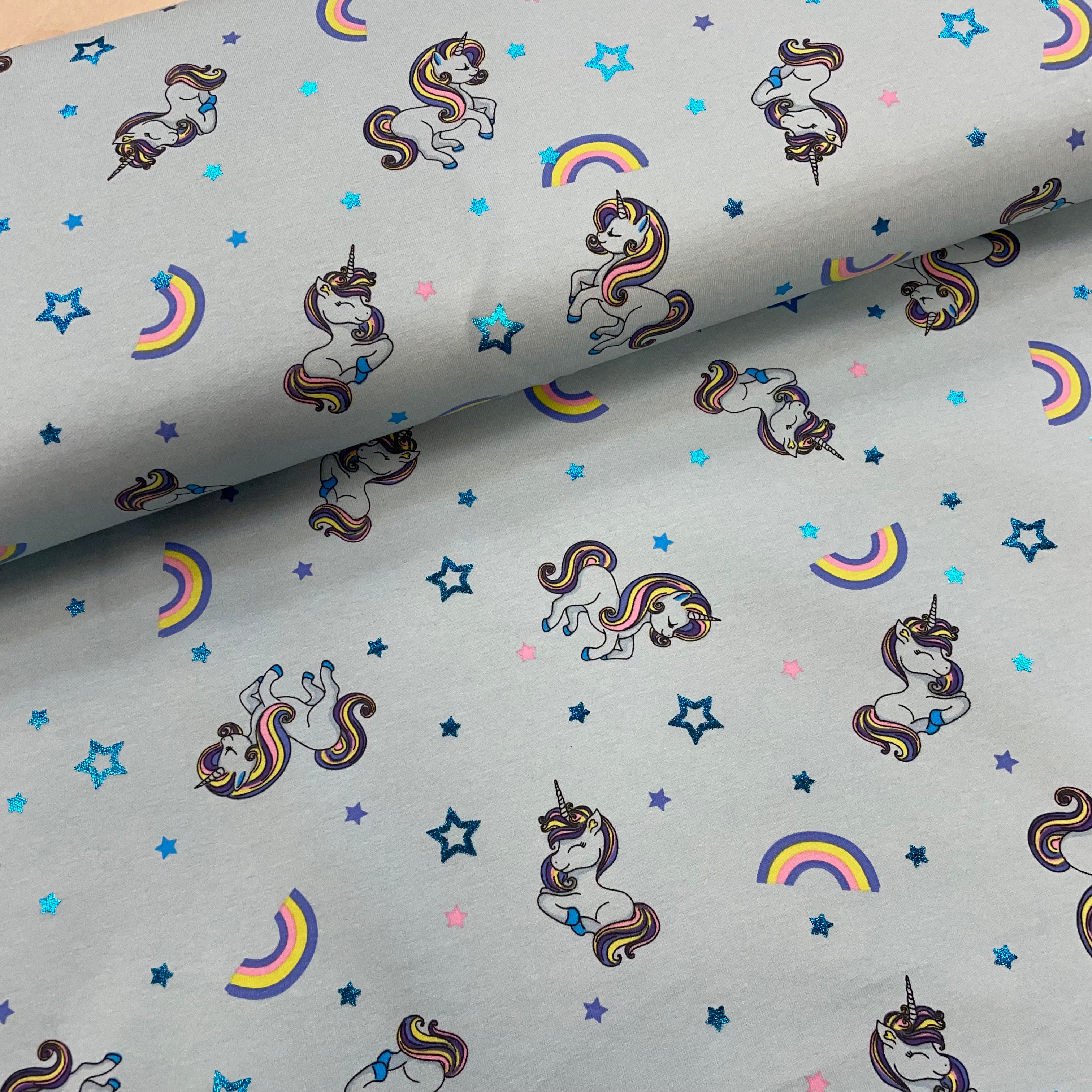 Unicorns with foil on blue Cotton Jersey Fabric
