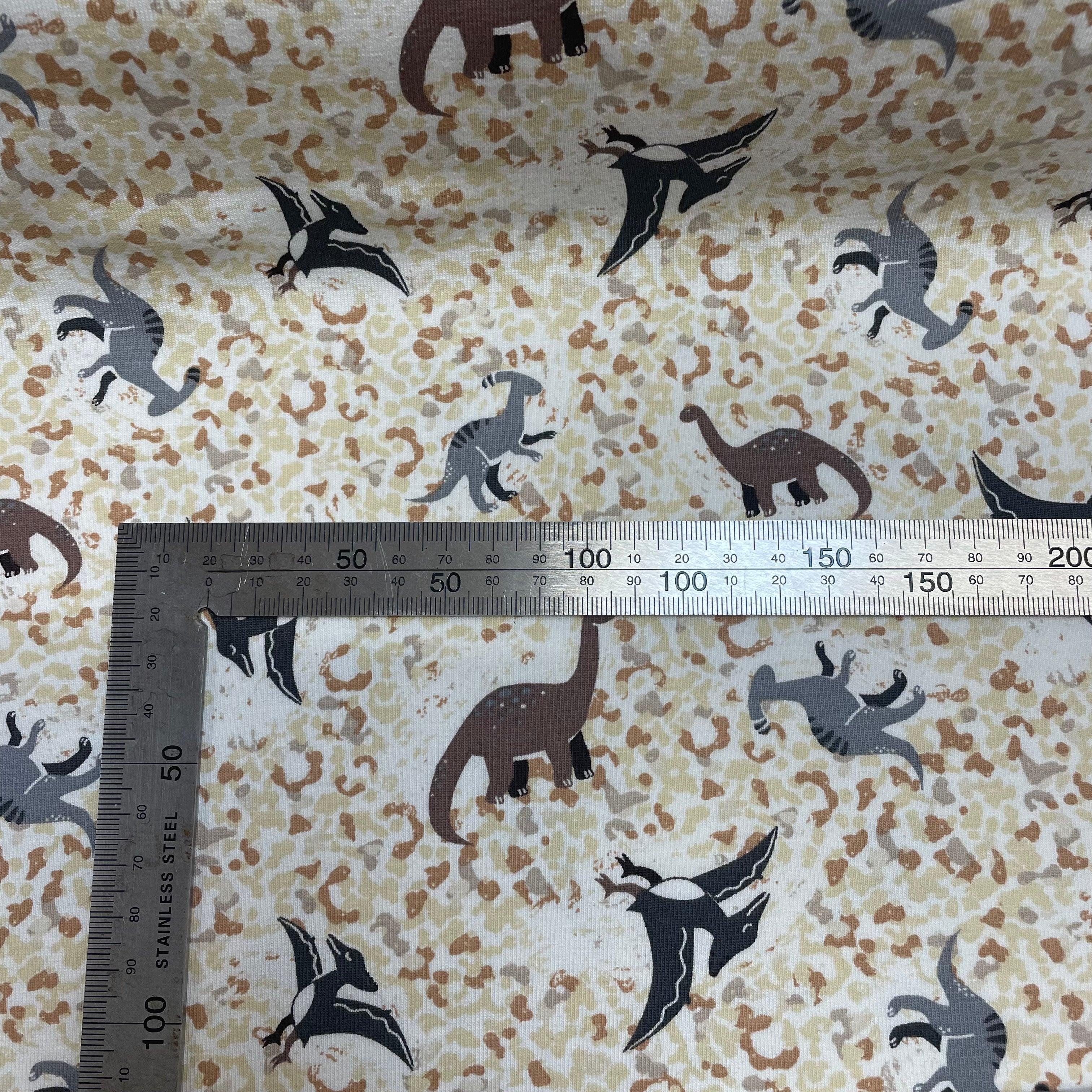 Small Dinosaurs on Sand texture Cotton Jersey Fabric