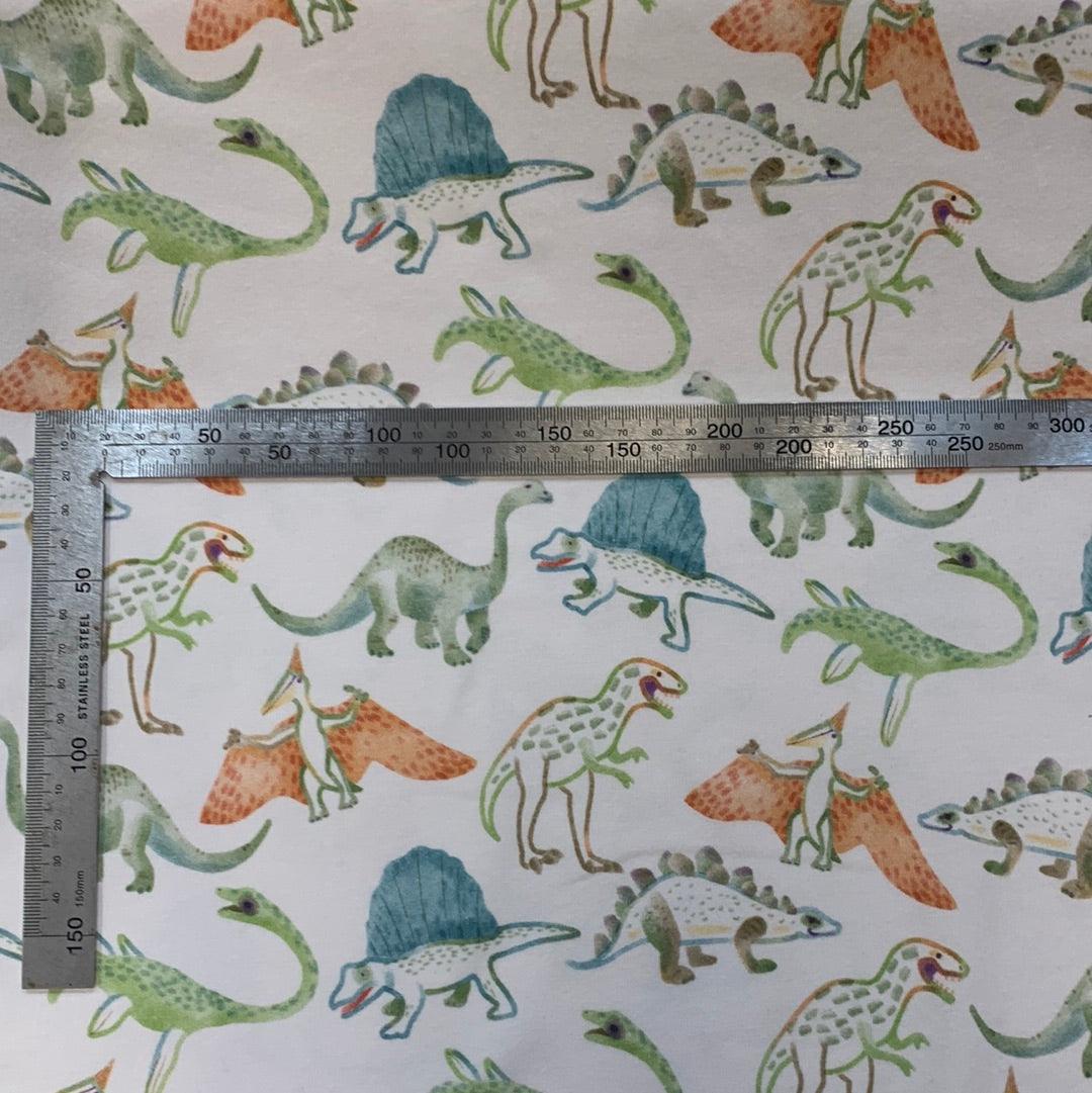 Playful Dinosaurs on Grey Cotton Jersey Fabric